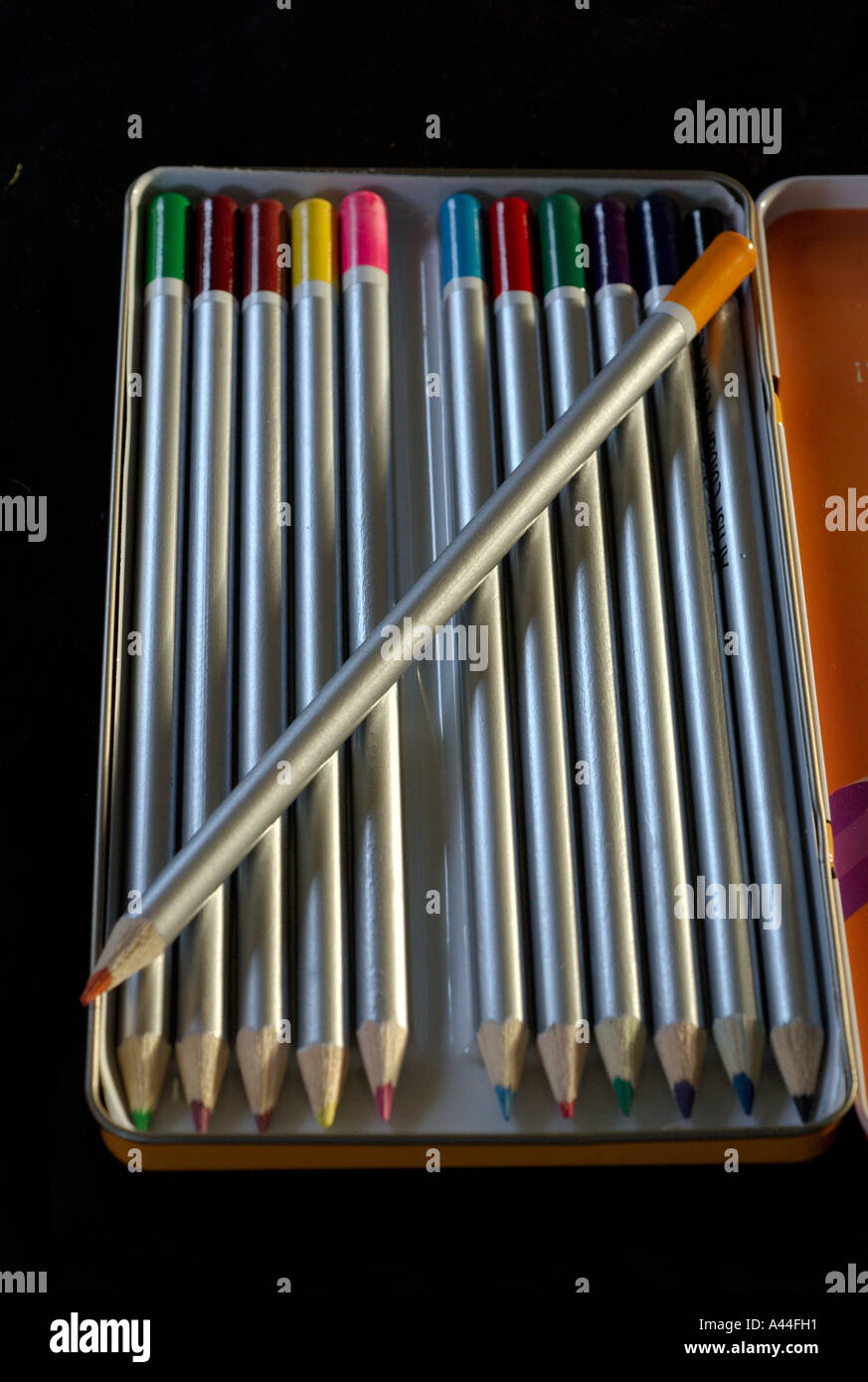 colour pencils in tin box Stock Photo Alamy