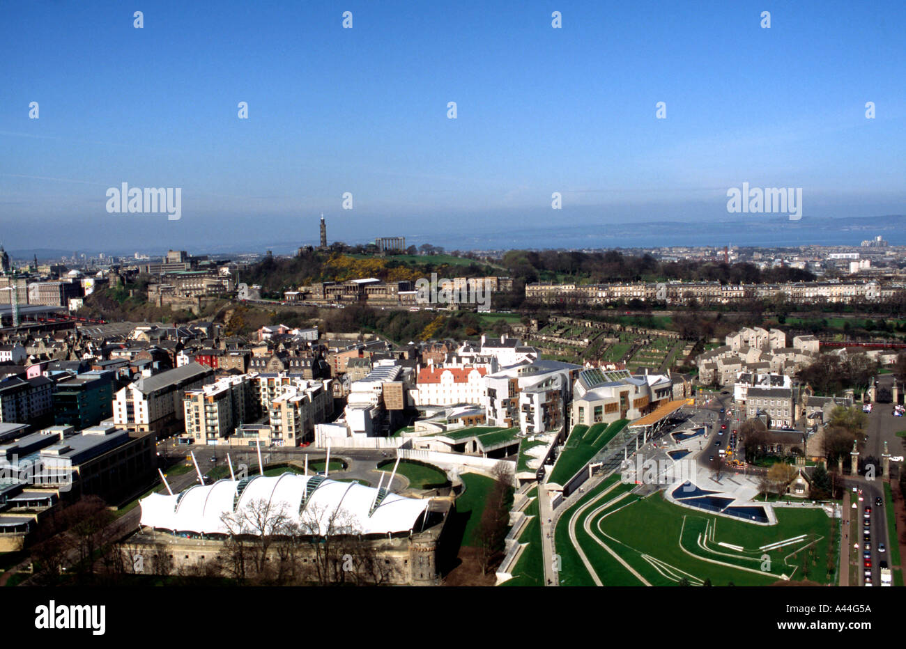 The Scottish Parliament and Calton Hill in Edinburgh Scotland from Salisbury Craigs Stock Photo