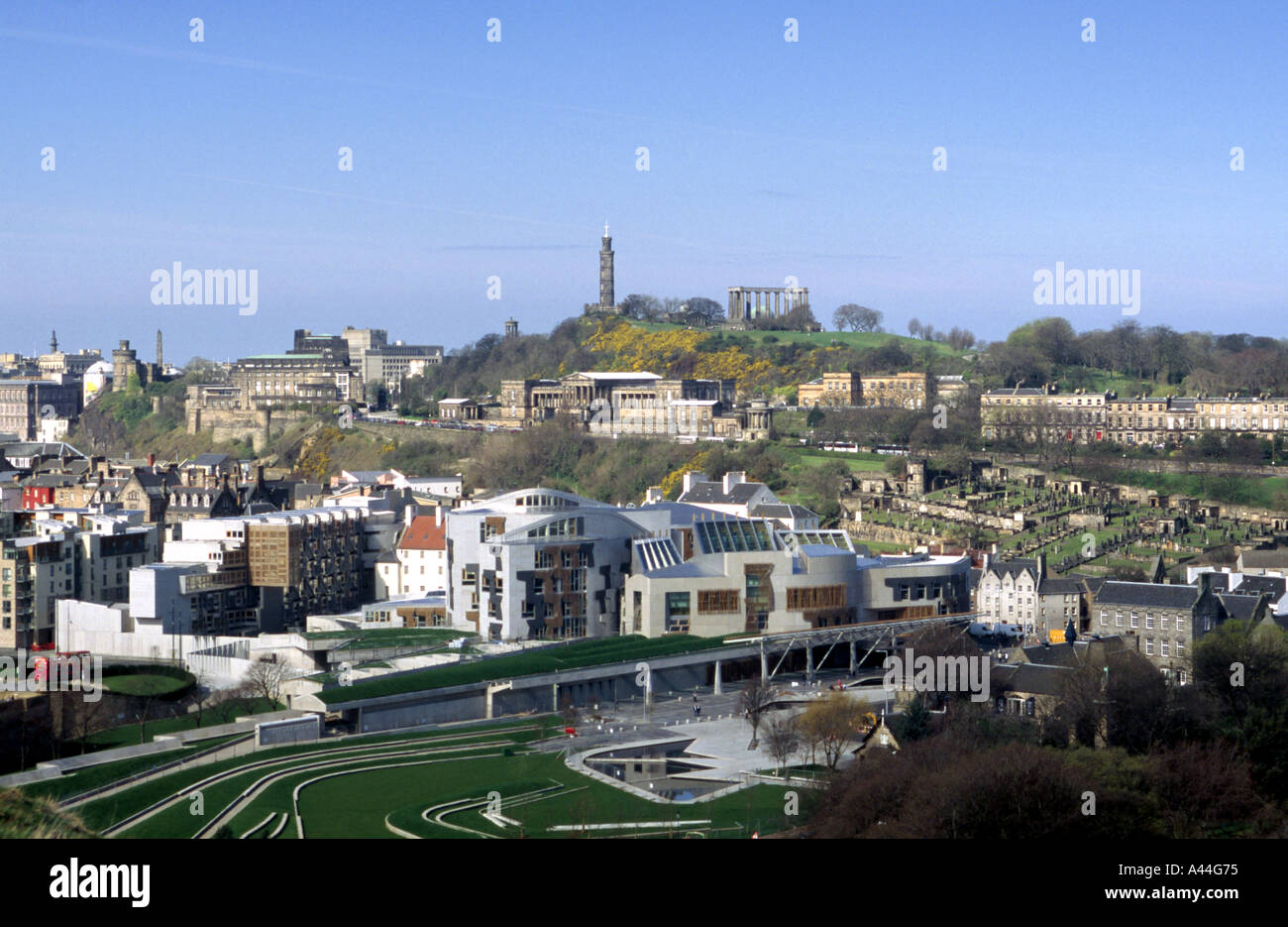 The Scottish Parliament and Calton Hill in Edinburgh from Salisbury Craigs Stock Photo