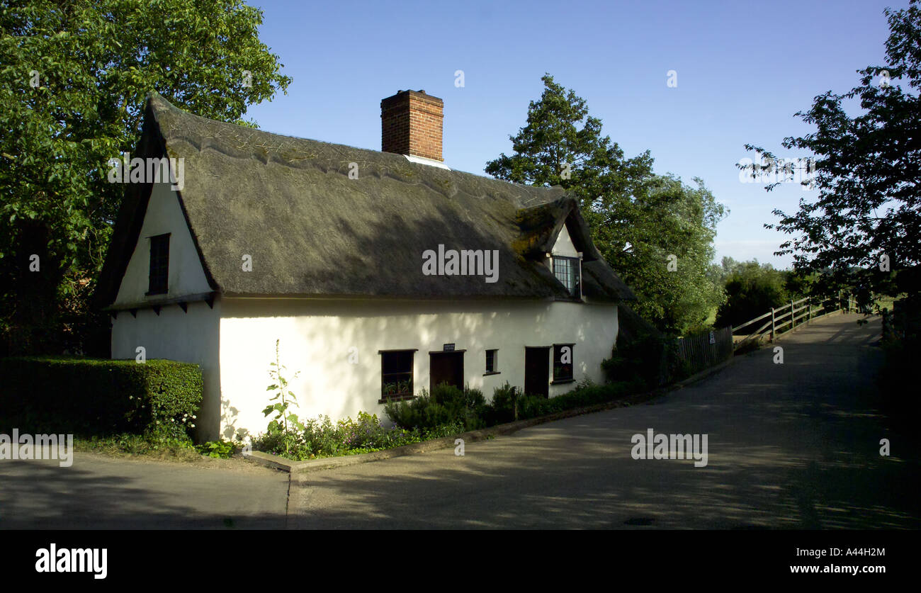Sixteenth century Bridge Cottage Flatford beside river Stour painted by John Constable near East Bergholt Suffolk Essex border Stock Photo