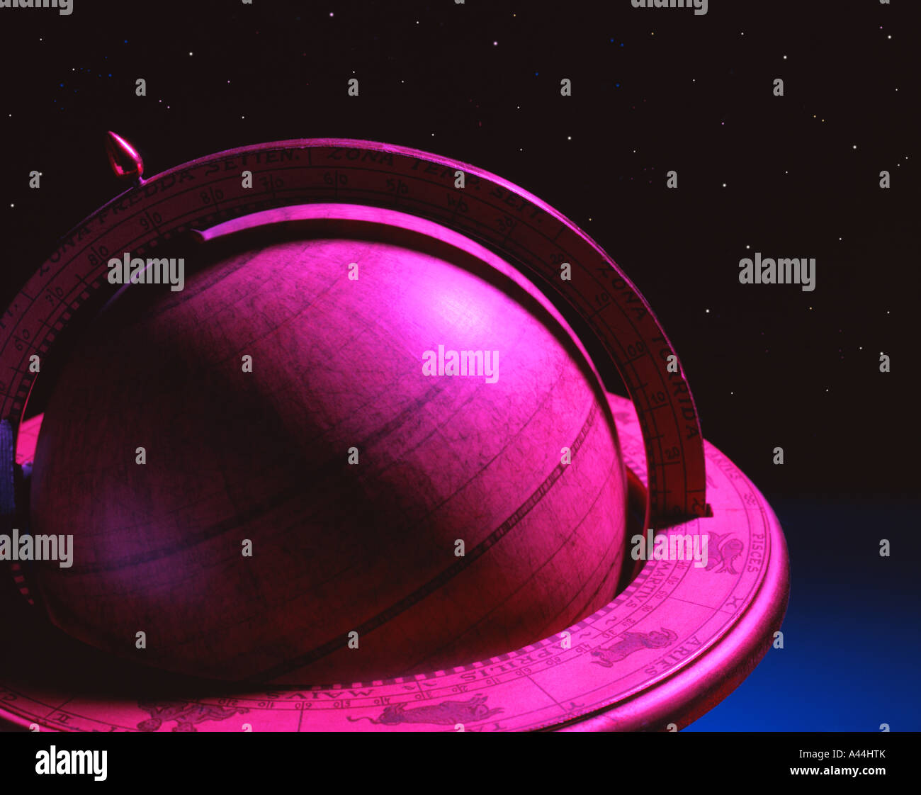 Globe with zodiac signs in front of night sky Stock Photo Alamy
