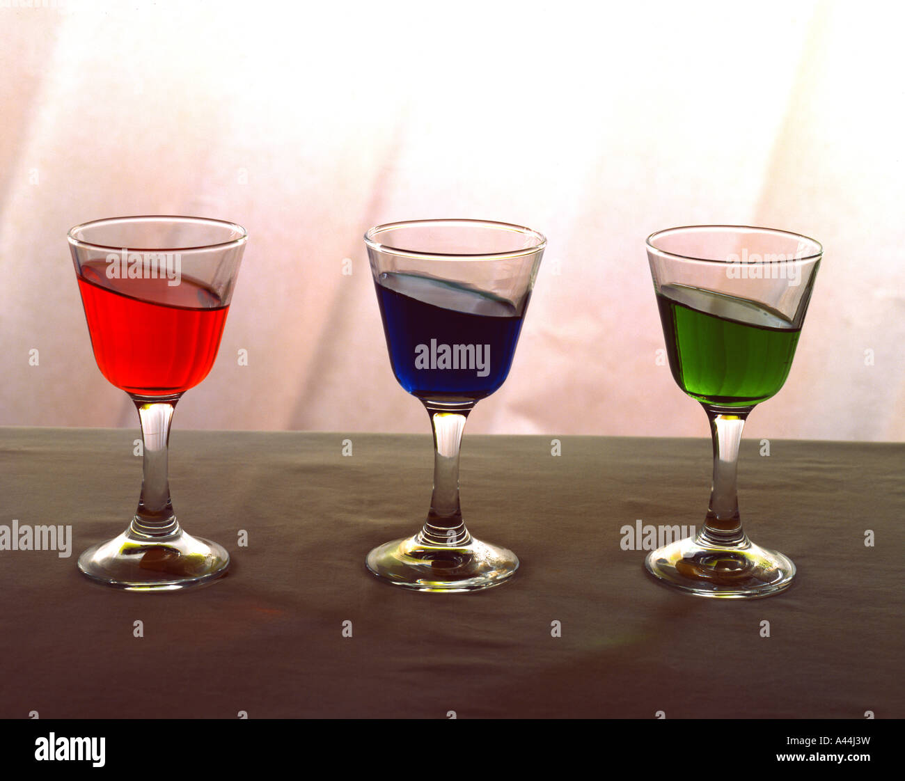 Cordial glasses with brightly colored liquid Stock Photo Alamy