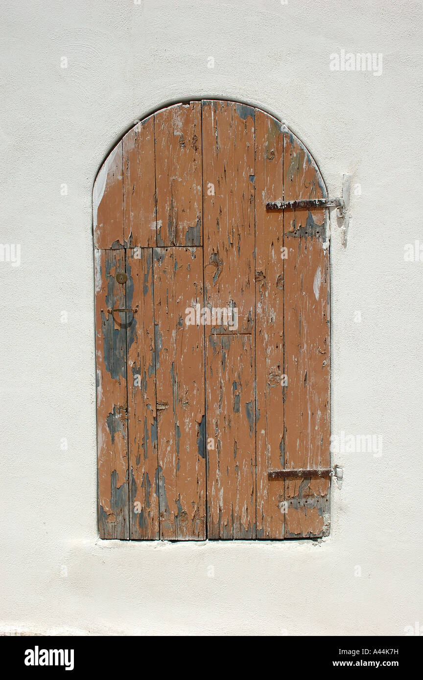 Closed brown painted wooden door, Peschici - Italy Stock Photo