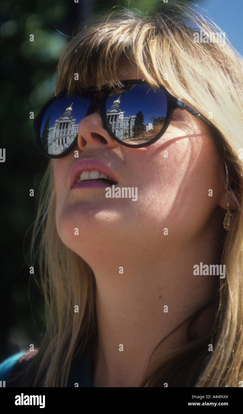 Portrait Of A Young Woman Wearing Mirrored Sunglasses,With Image Of The ...