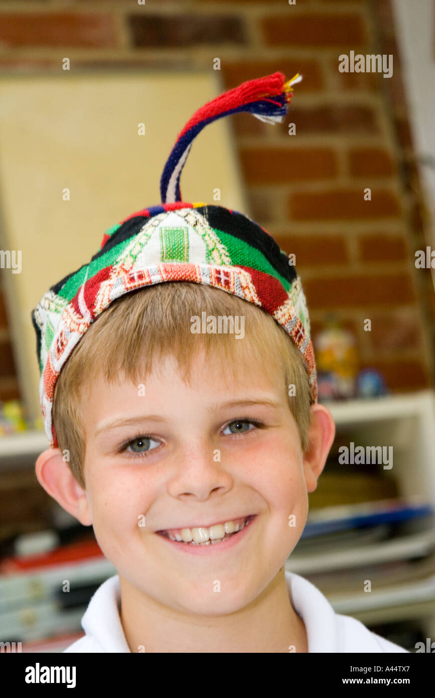 Portrait of a smiling eight year old boy with a hat on Stock Photo Alamy