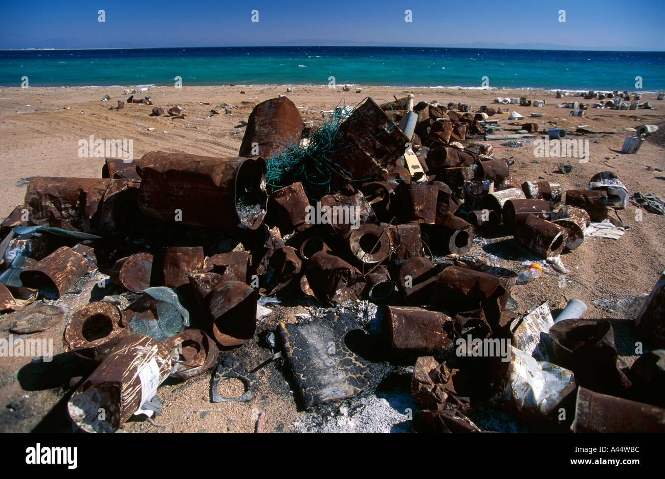 rusting rubbish dumped on a sandy beach at Dahab Sinai Egypt Stock ...