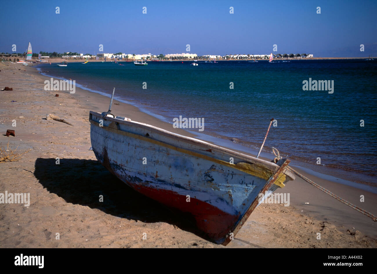 Old Weathered Fishing Boat Tied On Beach At Dahab Sinai Egypt Stock Old Weathered Fishing Boat Tied On Beach At Dahab Sinai Egypt Stock