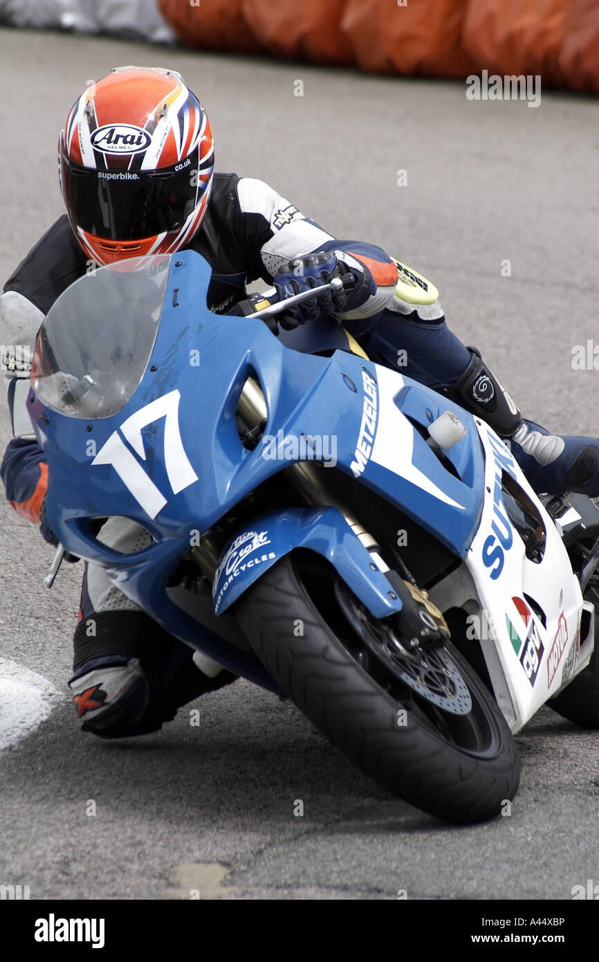 motorbike rider speed thrill with knee down on corner 17 Stock Photo