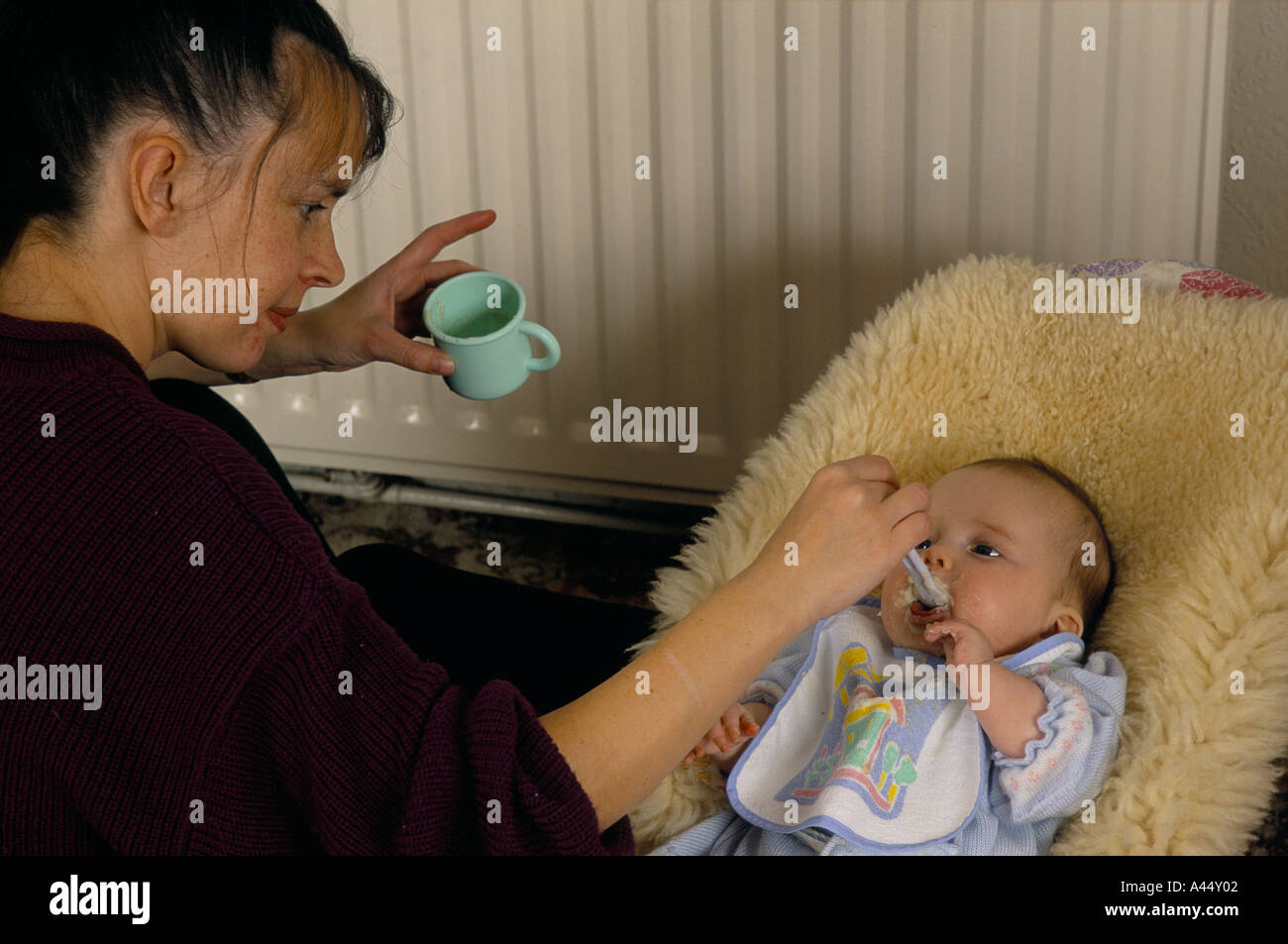 Woman Feeding 3 Month Old Baby Boy Stock Photo Alamy