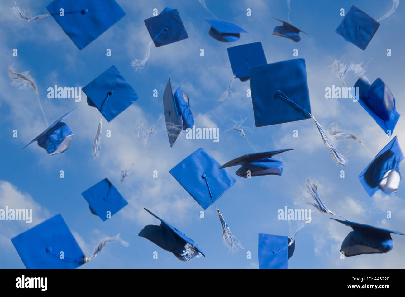 Graduation caps in the air Stock Photo Alamy