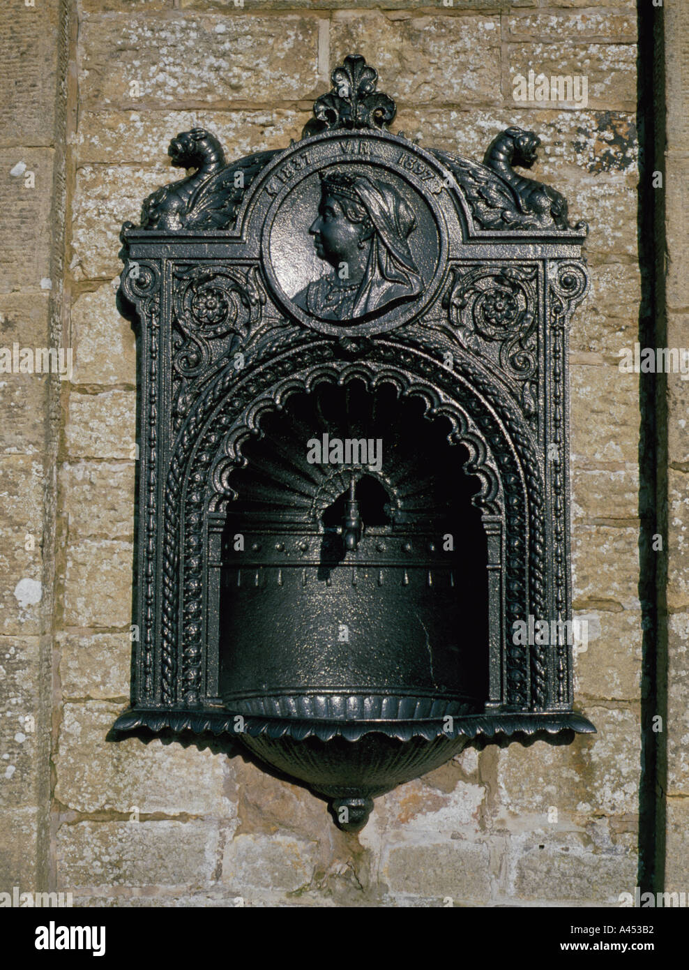 Cast iron drinking fountain commemorating 60 years of the reign of Queen Victoria, Falstone village, Northumberland, England, UK Stock Photo