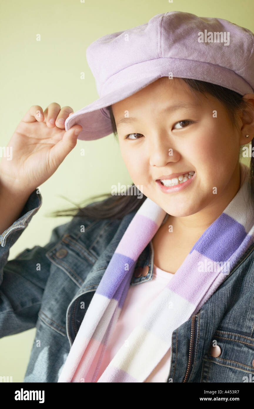 Portrait of a girl tipping her hat Stock Photo Alamy