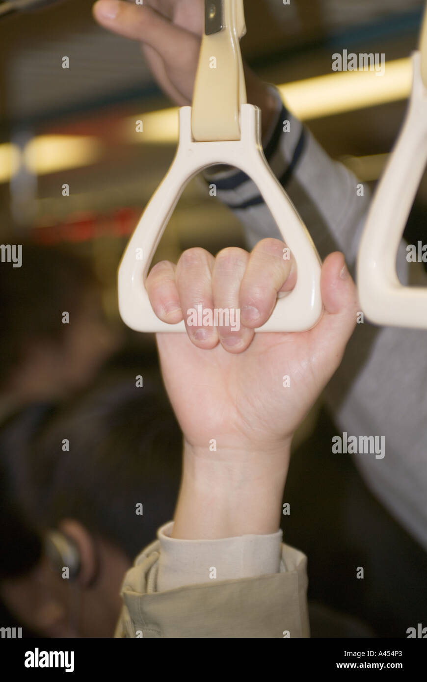 Close up Of Persons Hand Holding Handclasp Riding On Subway Taipei Taiwan China Stock Photo