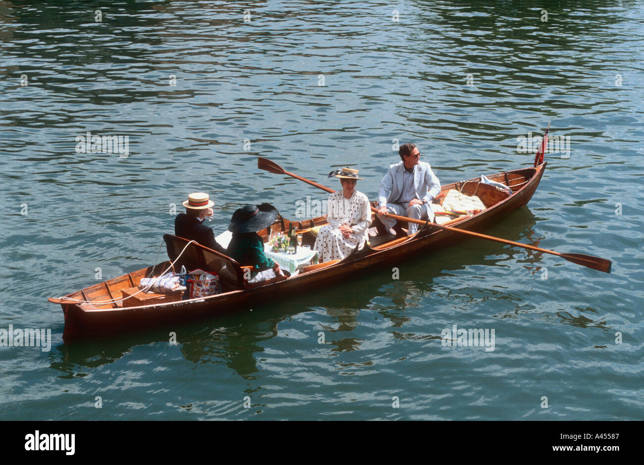 People in a double skiff at Henley Royal Regatta River Thames Henley on Thames Oxfordshire England UK Stock Photo