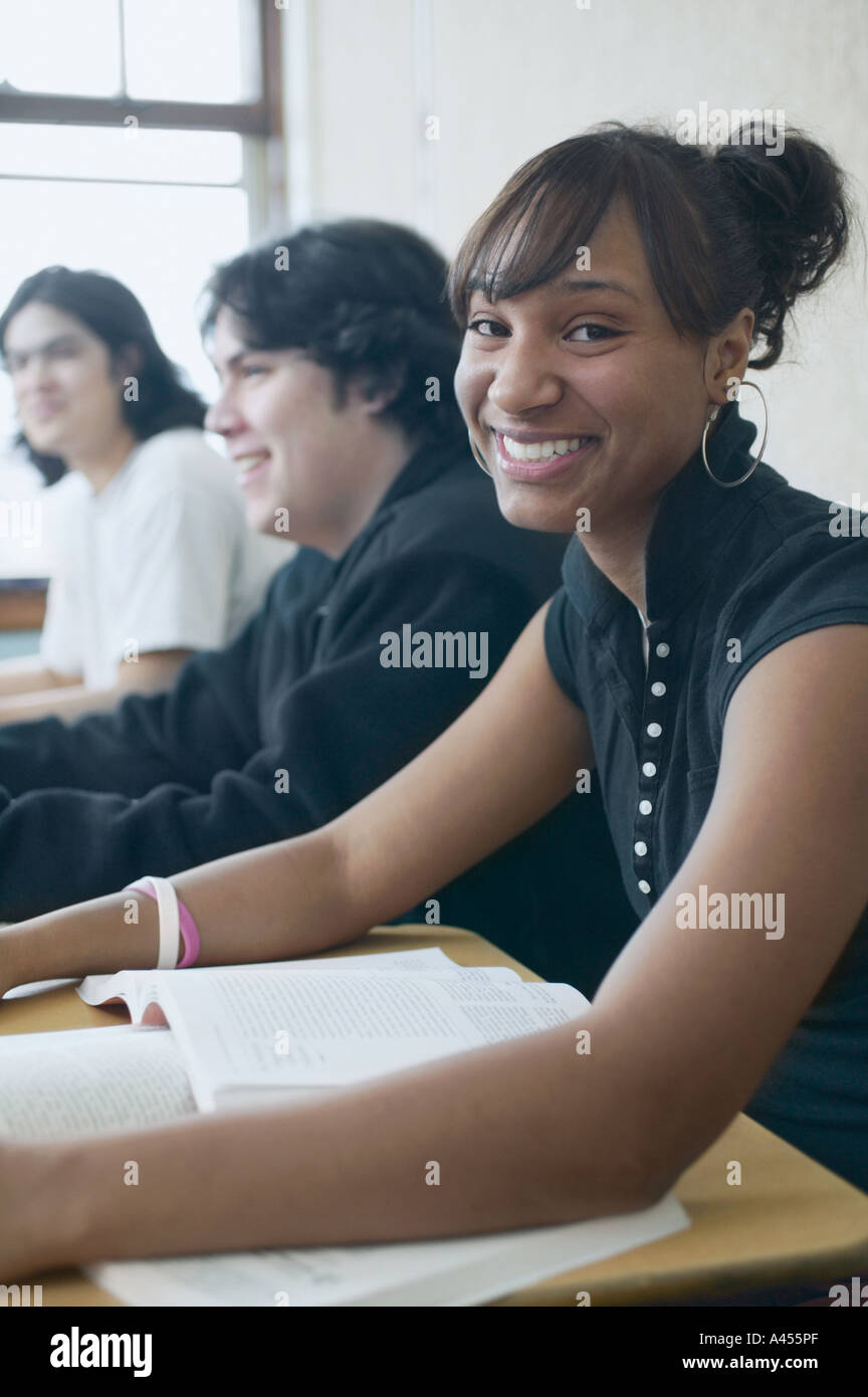 Three high school students in classroom Stock Photo