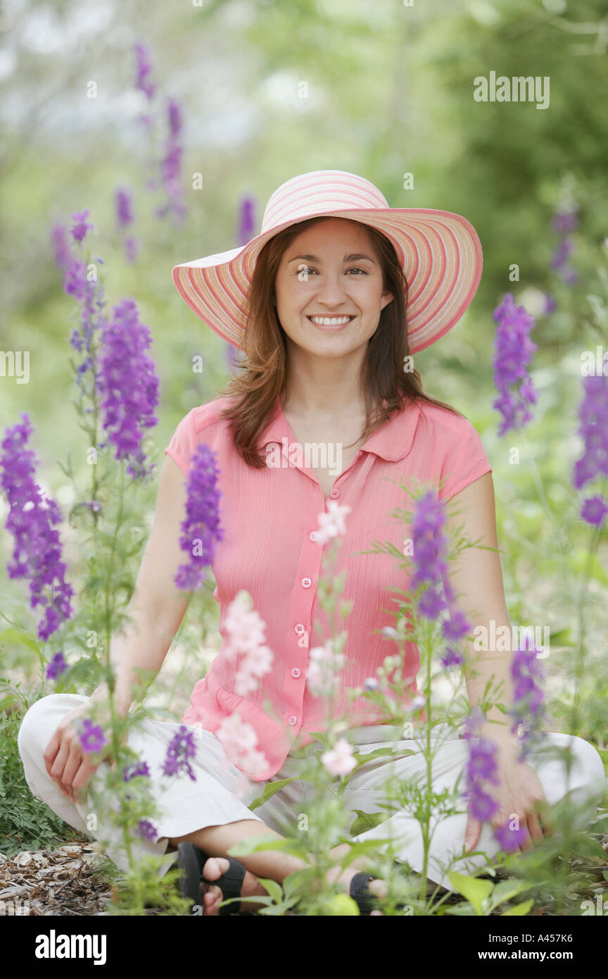 Portrait of woman in garden Stock Photo - Alamy