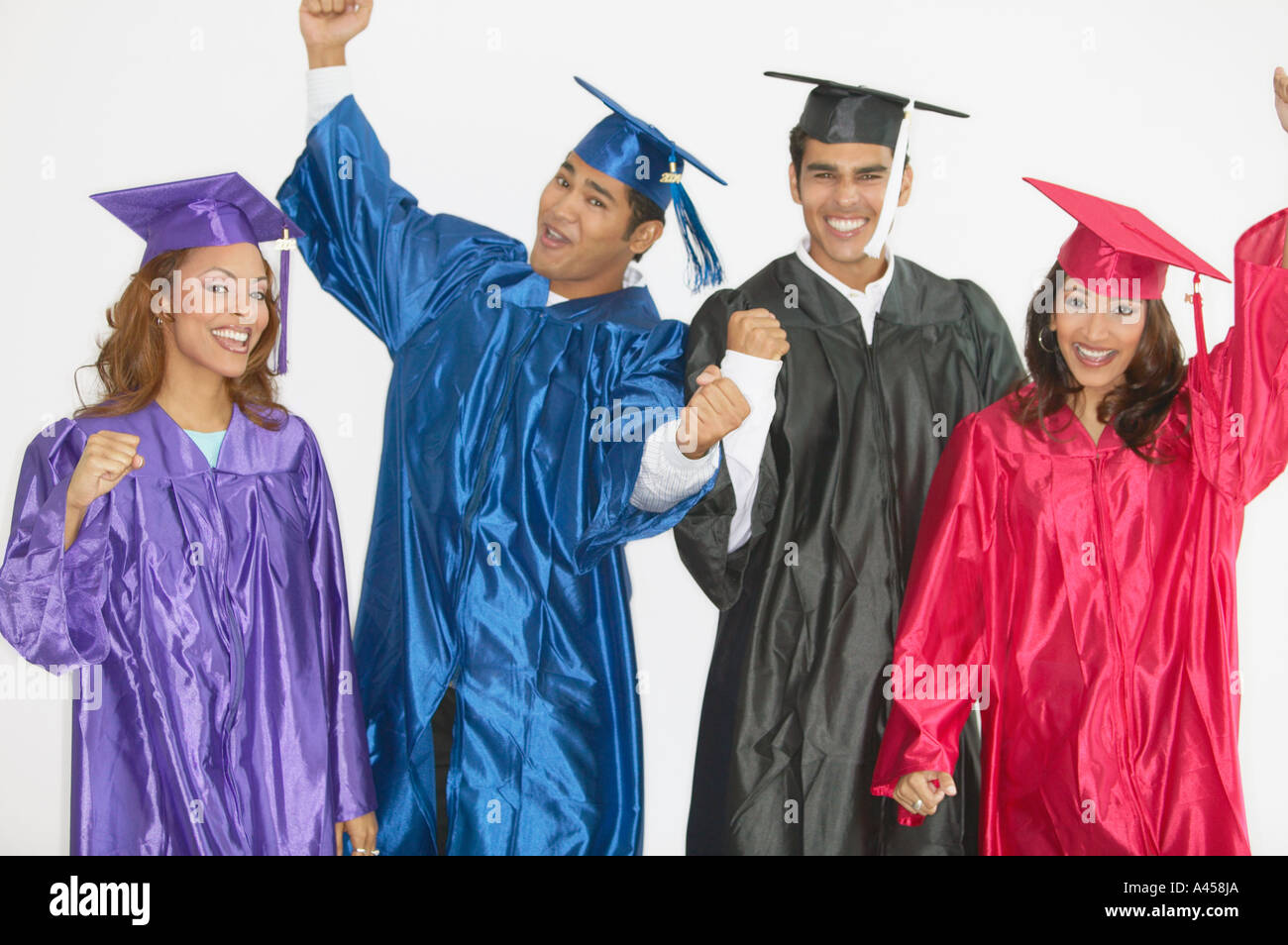 Group of graduates wearing caps and gowns Stock Photo - Alamy
