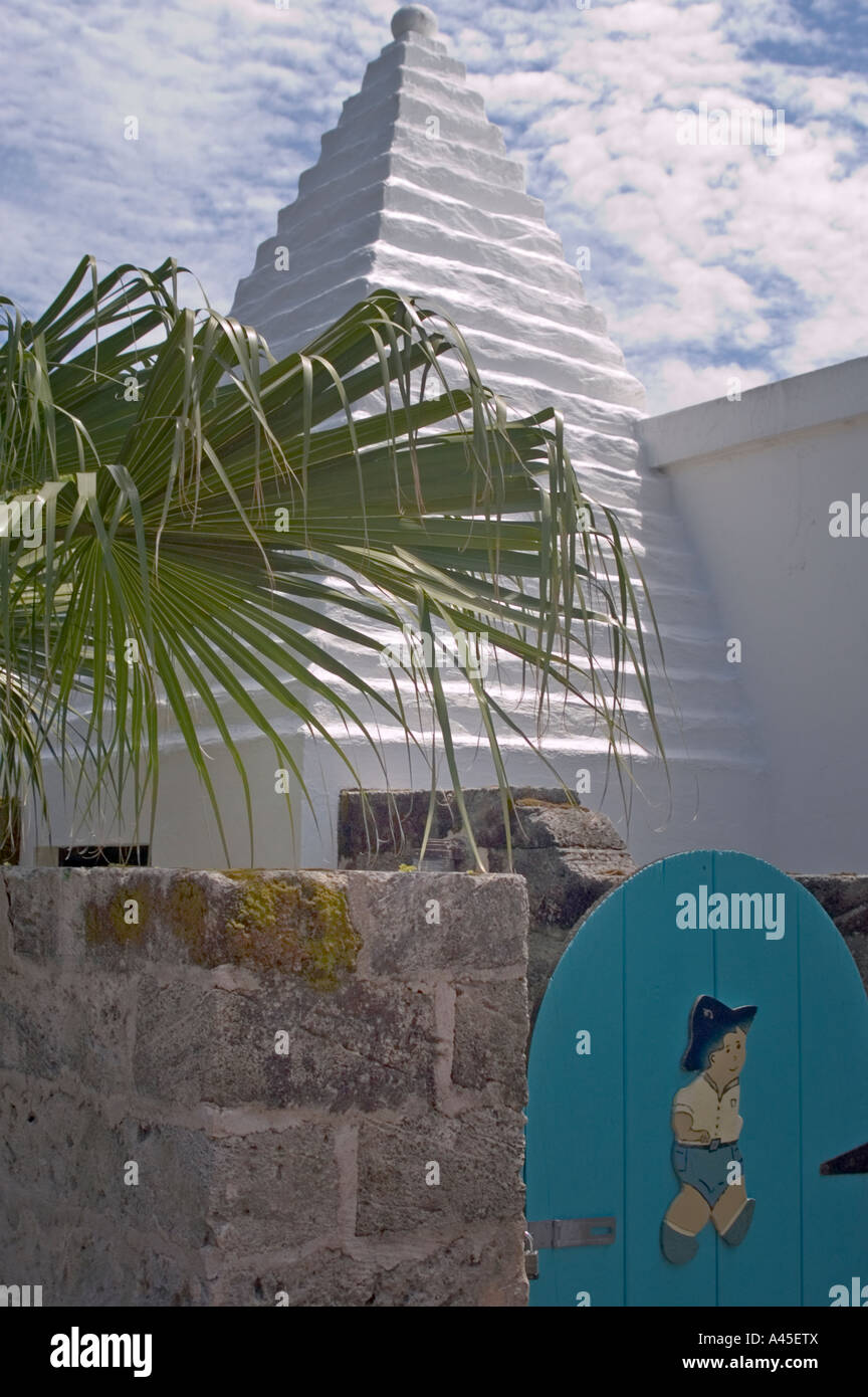 A toilet with an outside entrance sports a traditional Bermuda roof Stock Photo