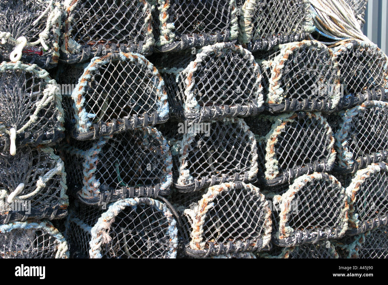 Lobster pots and crab pots on the quay in Padstow Cornwall Stock Photo