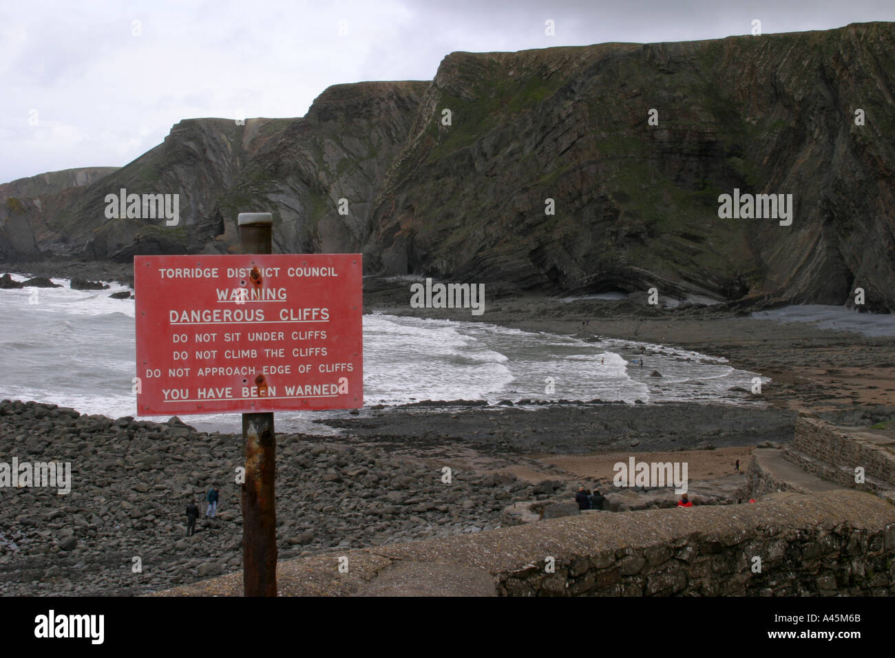 Danger sign warning of cliff falls at Hartland Quay North Devon Stock ...