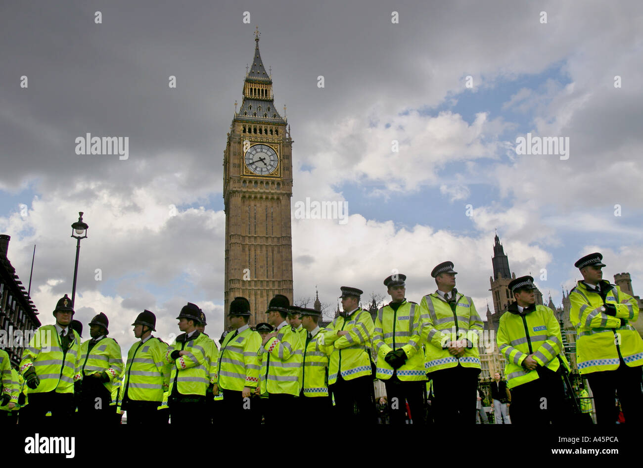 police officers line up in front of the houses of parliament at an anti ...