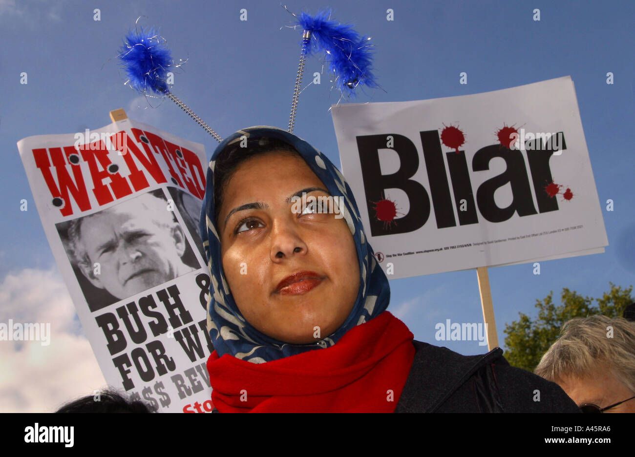 a muslim woman marches at an anti war demonstration in trafalgar square in london an estimated 100 000 people turned out to call for the withdrawal of us and british troops from iraq and palestinian independence Stock Photo