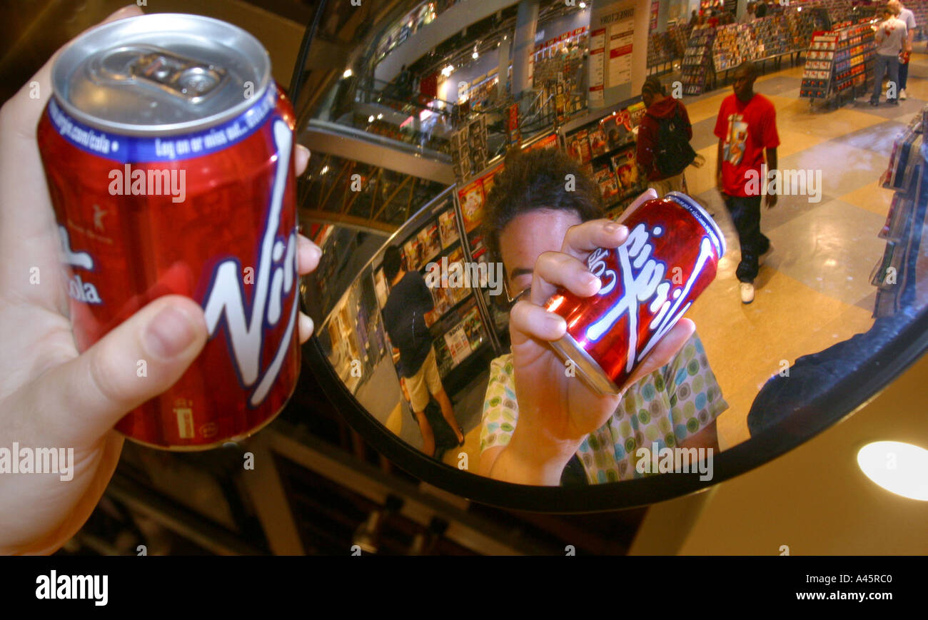 a customer reaches for virgin cola in the virgin megastore in oxford