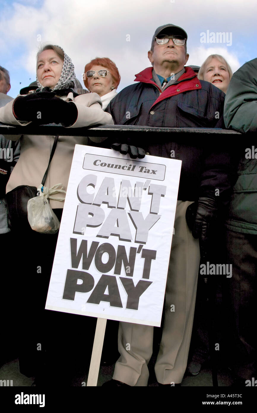 people listen to speeches during the is it fair rally of pensioners in trafalgar square against government council tax rises Stock Photo