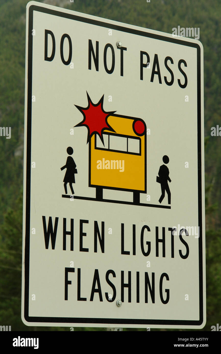 AJD55763, British Columbia, Canada, Do Not Pass When Lights are Flashing, School Bus road sign Stock Photo