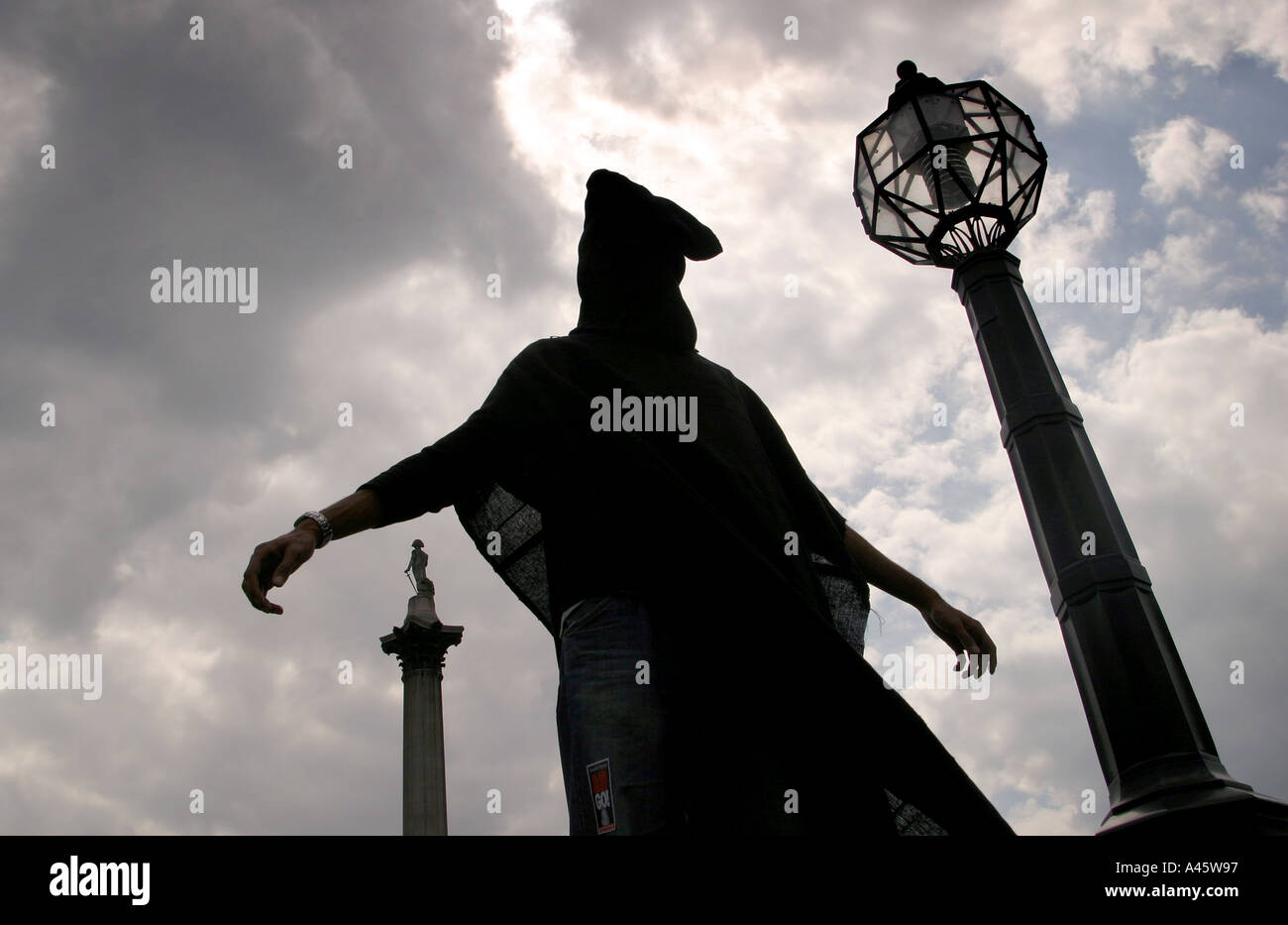 a protester poses as an abused abu ghreib prison inmate during a demonstration in london against the israeli governments building of a security wall around the west bank and gaza and the ongoing us and british occupation of iraq 15 may 2004 Stock Photo