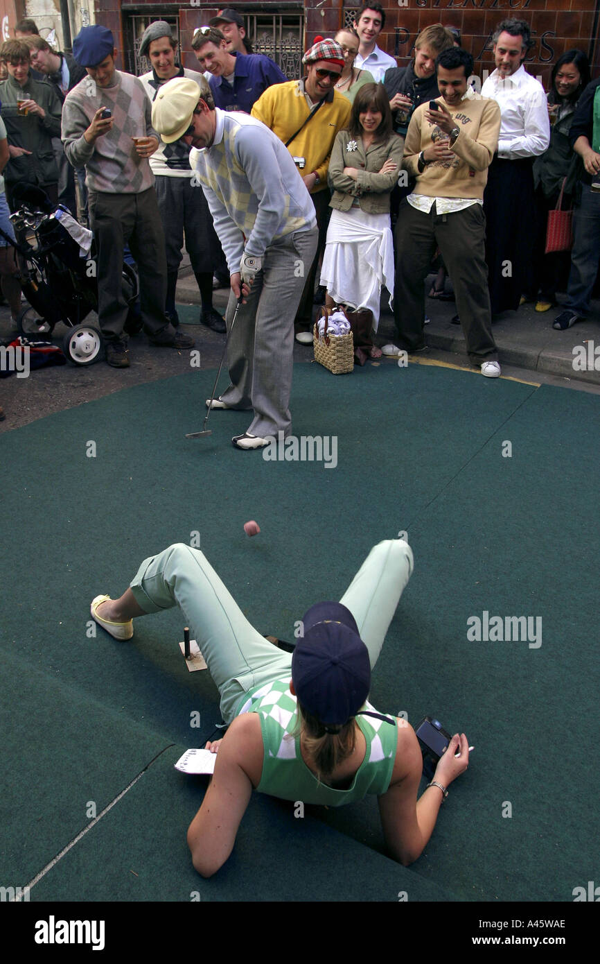 urban golf competitors at the 18th hole at the first shoreditch urban open tournament in london Stock Photo