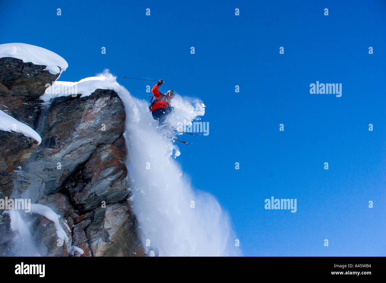 British skier Nick Southwell jumping off an overhang at Verbier Switzerland Stock Photo