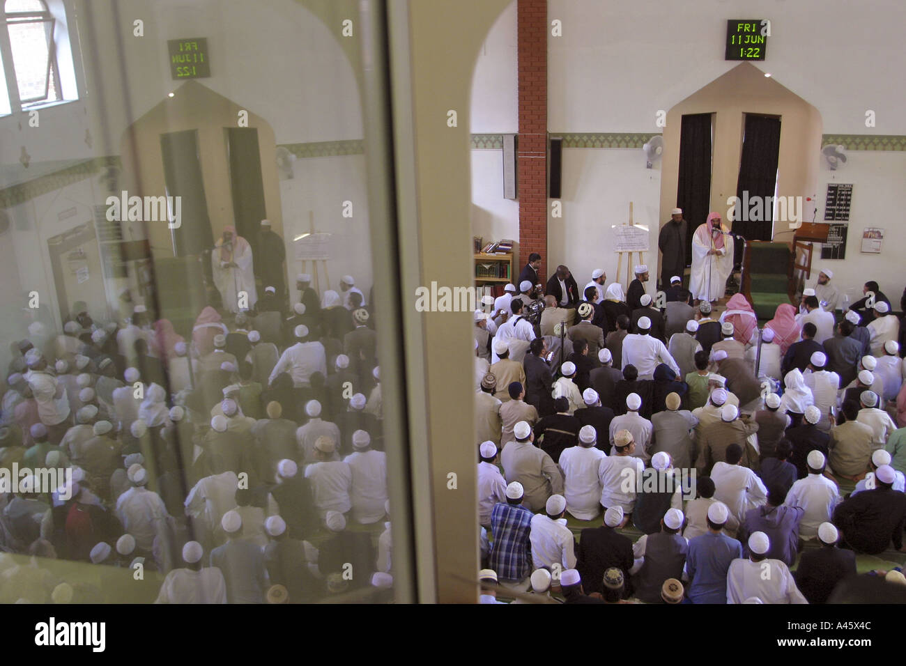 muslim men pray in the east london mosque in whitechapel in the east end of london Stock Photo