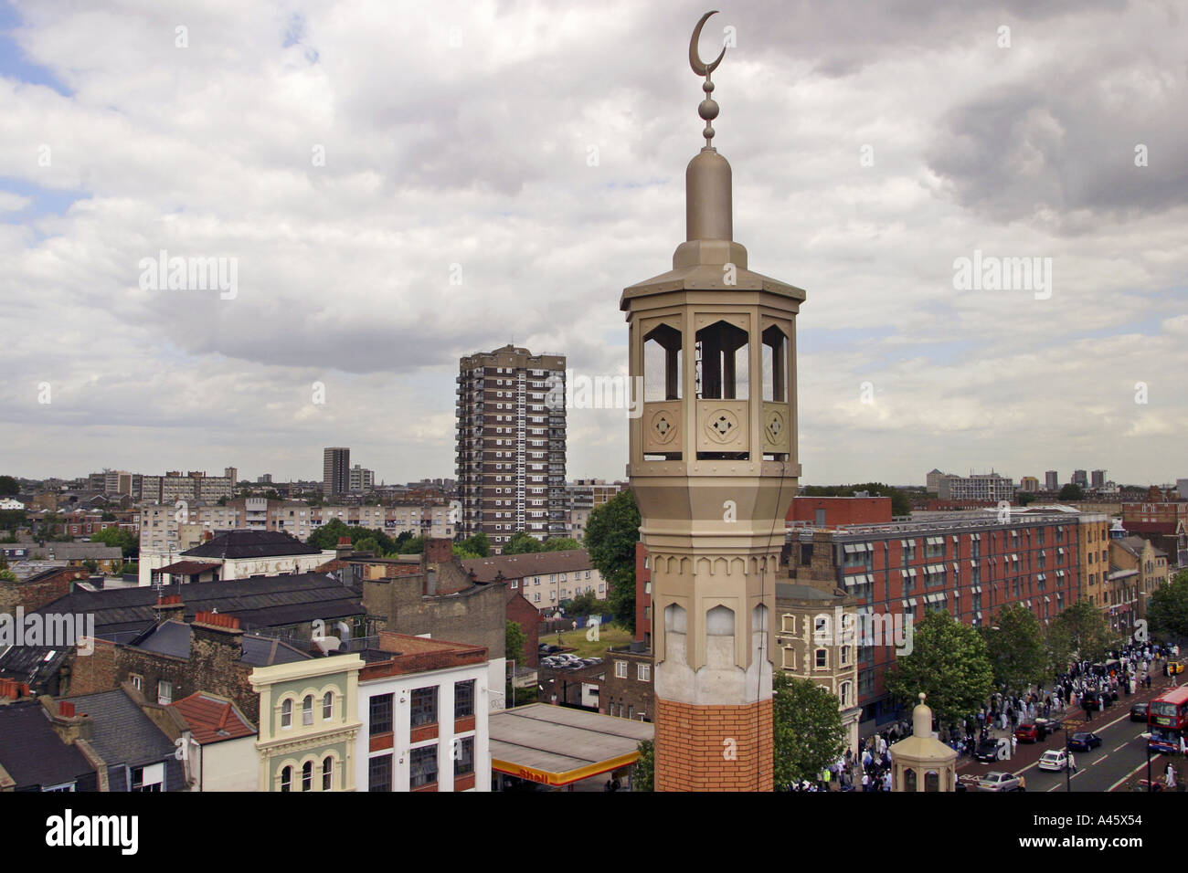 the minaret of the east london mosque is viewed over whitechapel high street in the east end of london Stock Photo