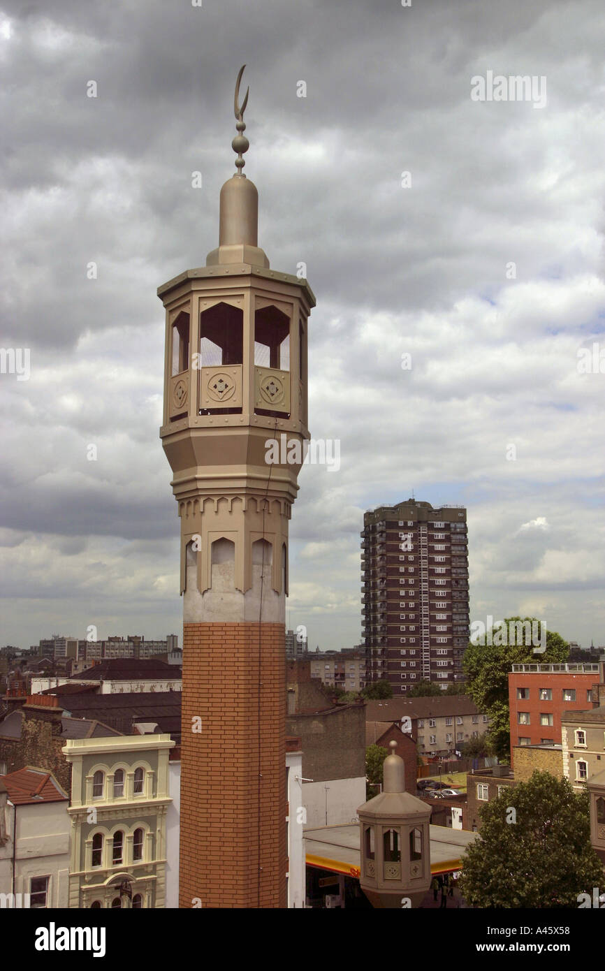 the minaret of the east london mosque is viewed over whitechapel high street in the east end of london Stock Photo