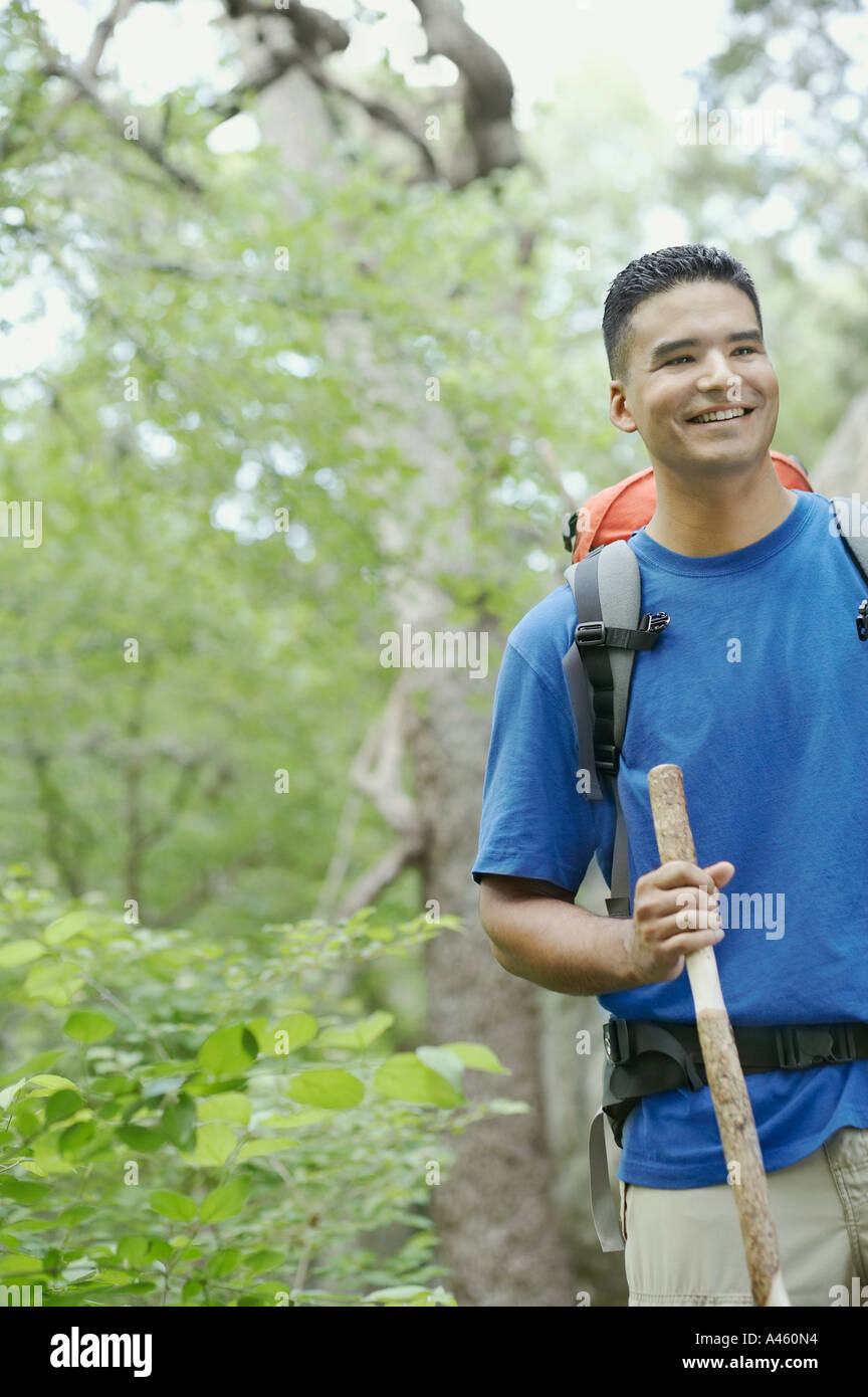 Handsome young man hiking in forest 20s adult hi-res stock photography ...