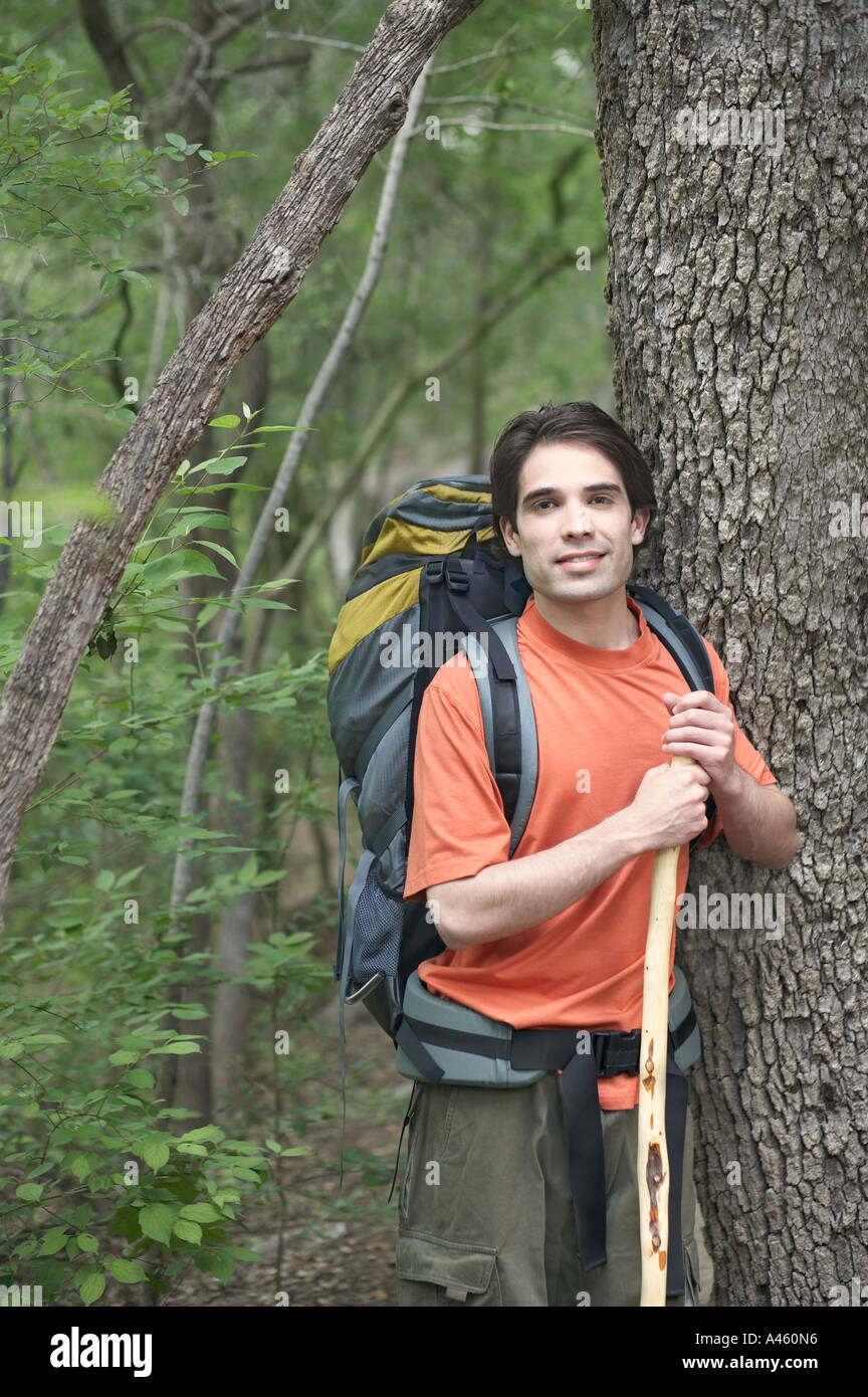 Handsome young man hiking in forest 20s adult hi-res stock photography ...