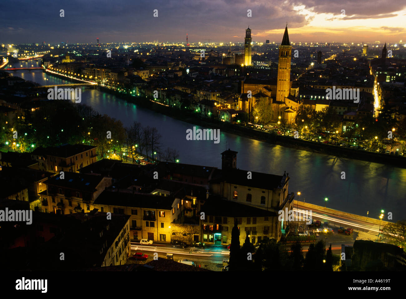 ITALY Veneto Verona View over the Adige river and city skyline illuminated at night Stock Photo