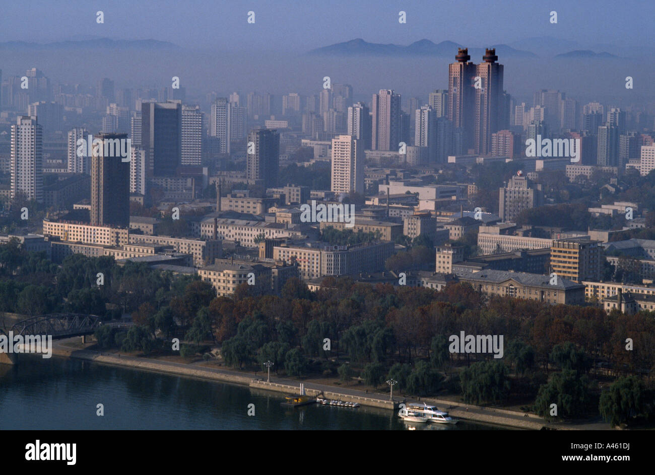 NORTH KOREA Asia Pyongyang Cityscape with the Koryo Hotel twin towers amongst other skyscrapers with smog pollution Stock Photo