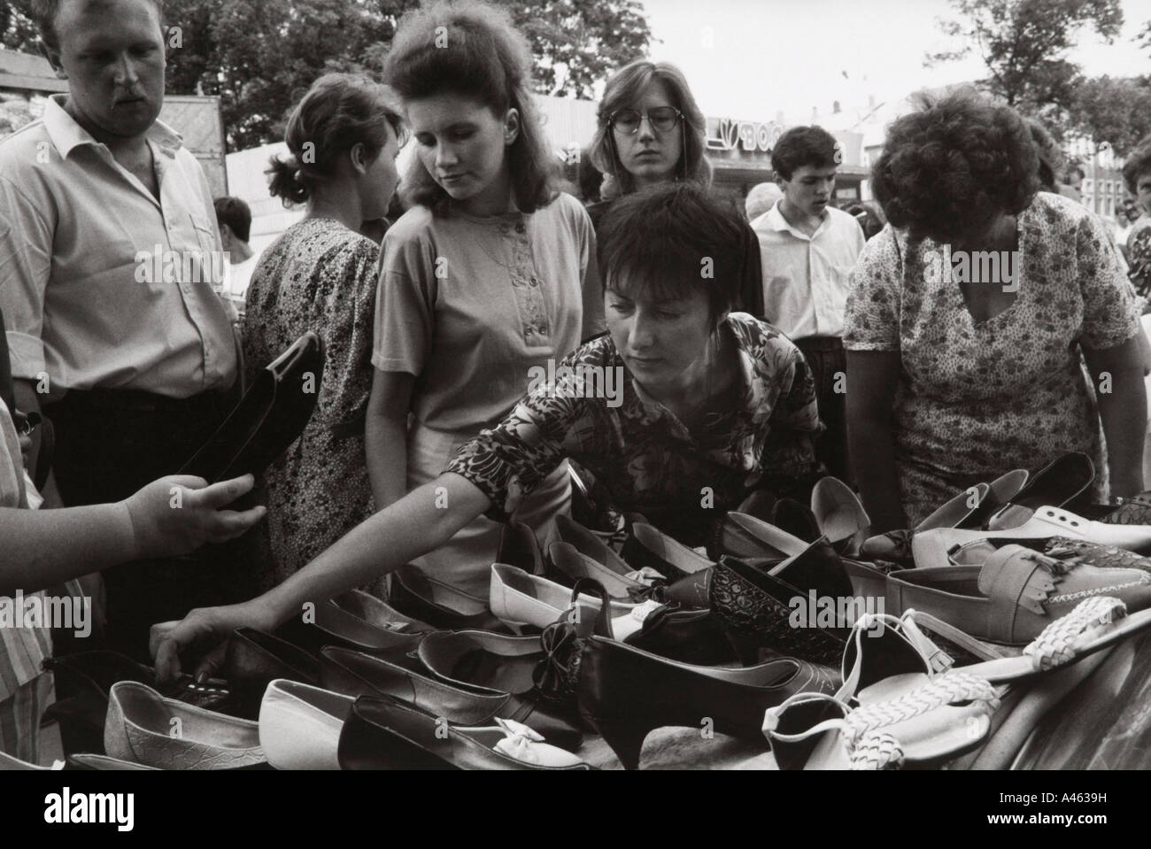 Russian women choosing shoes on a market stall in Smolensk.     No 22 Stock Photo
