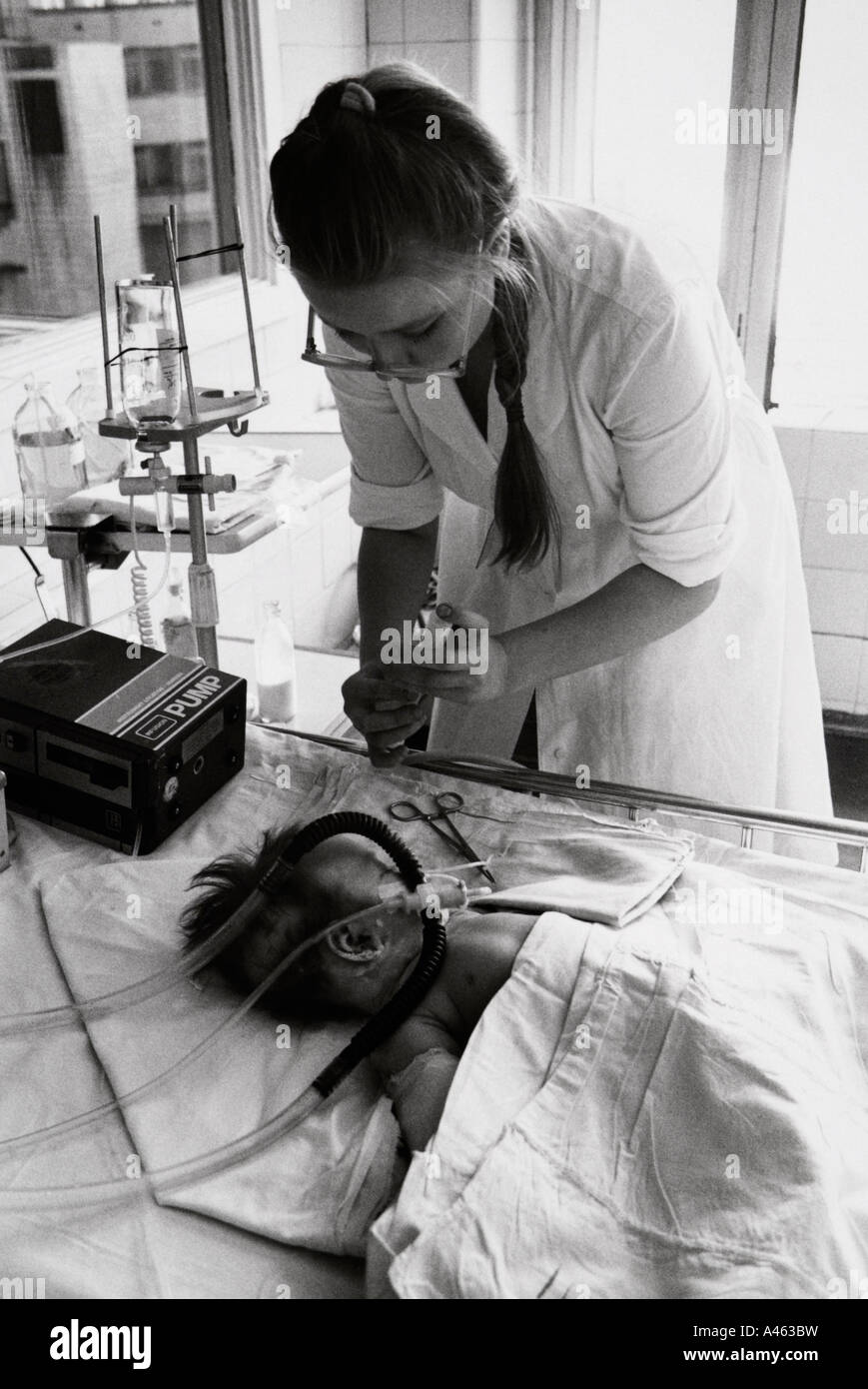 Russian nurse tending sick baby in a hospital in  St Petersburg.  No 9 Stock Photo