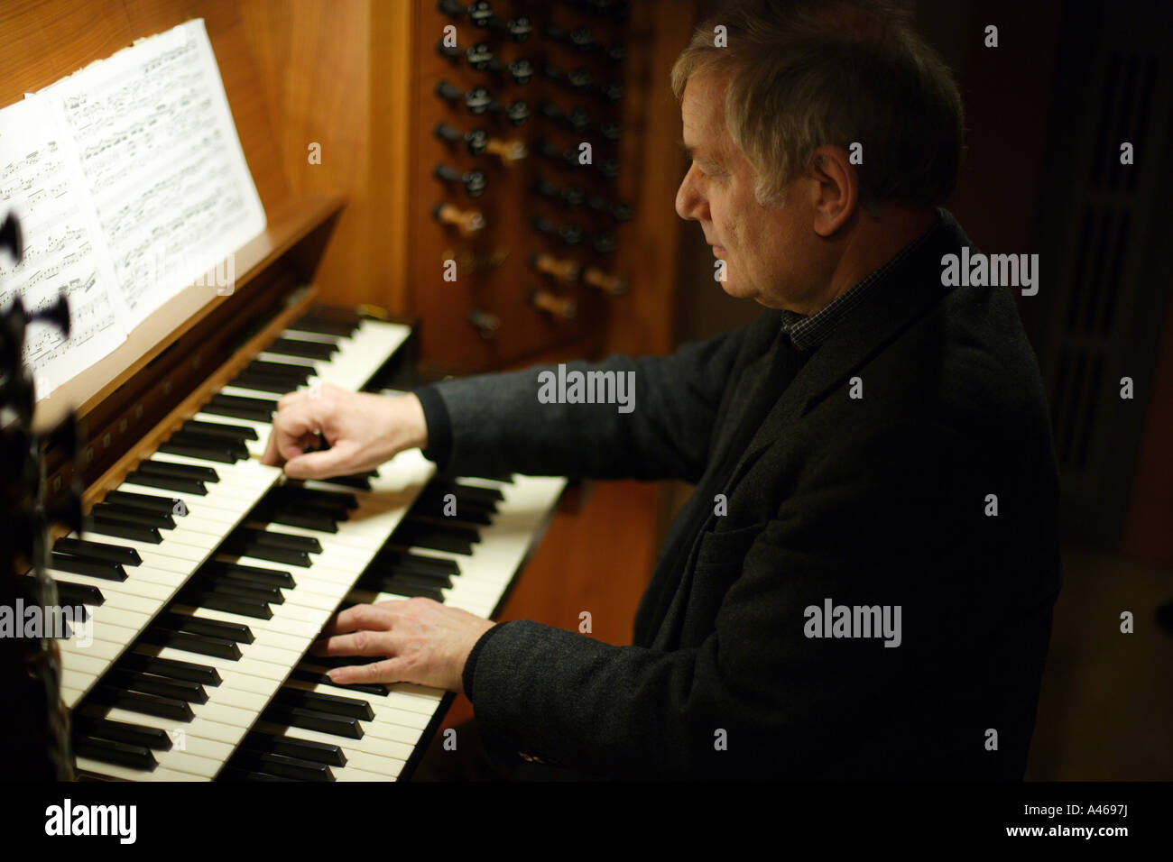 Organist Heinz Terboyken at the organ in the St Lambertus churc Stock Photo