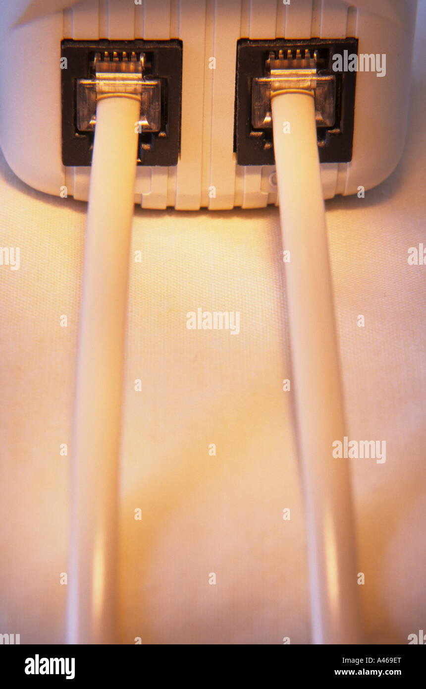 Telephone jacks plugged into wall outlet Stock Photo Alamy