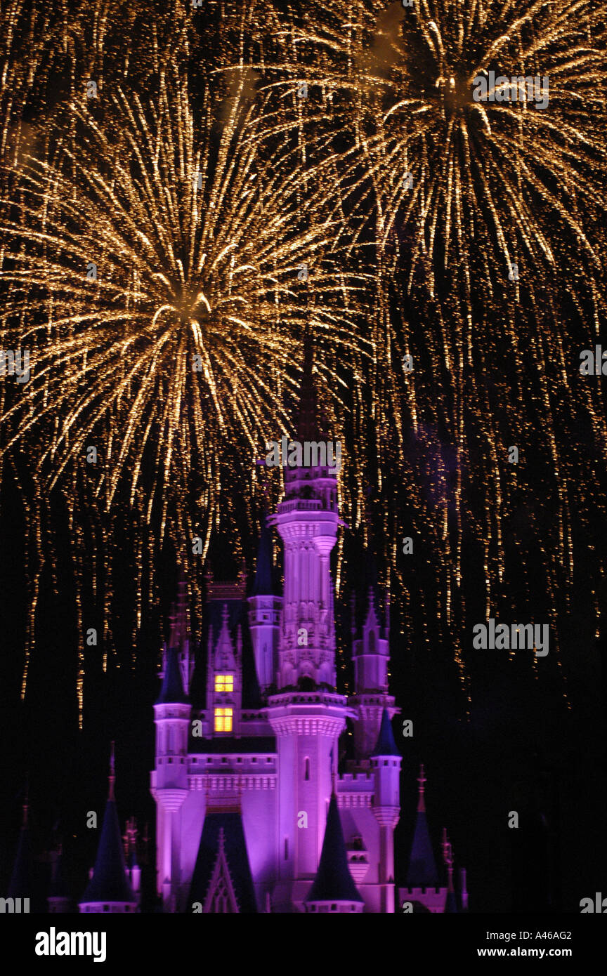Disney World Magic Kingdom Cinderella Castle at night fireworks action display dazzle magical dark background Stock Photo