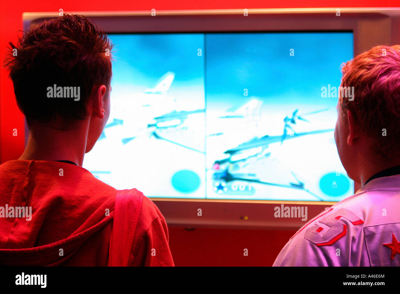 Two teenage boys playing NINTENDO GAMECUBE on an LCD monitor, Berlin, Germany Stock Photo