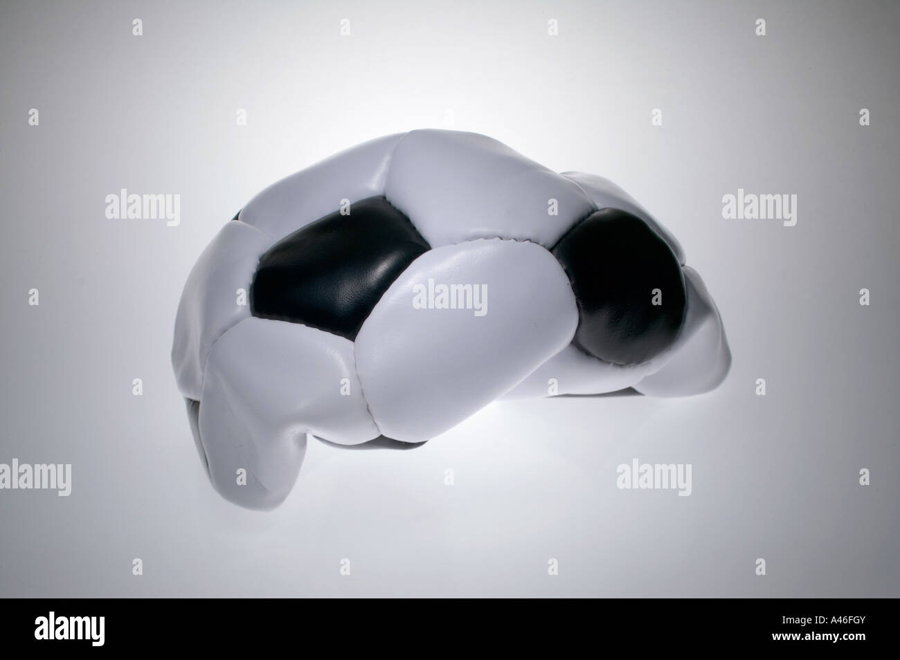 A deflated soccer ball on black and white background Stock Photo Alamy