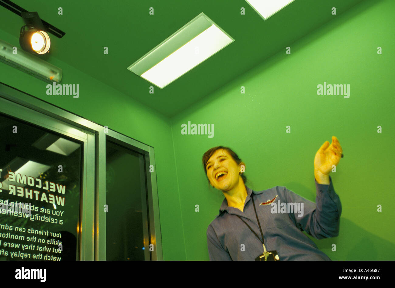 a visitor makes a weather forecast on a video screen national space centre leicester united kingdom Stock Photo