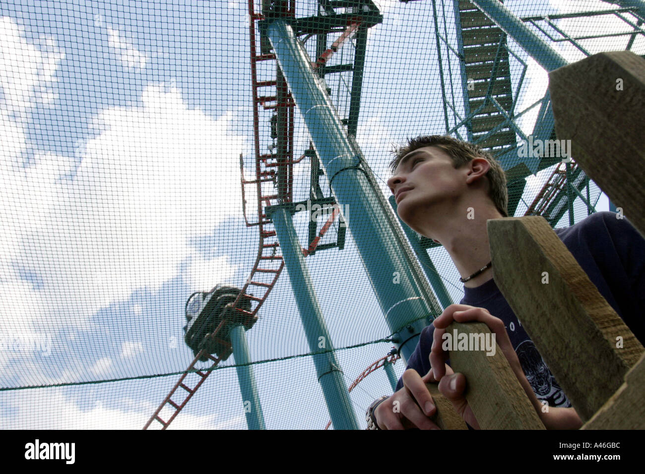 A visitor in a queue for the spinball whizzer ride at alton towers