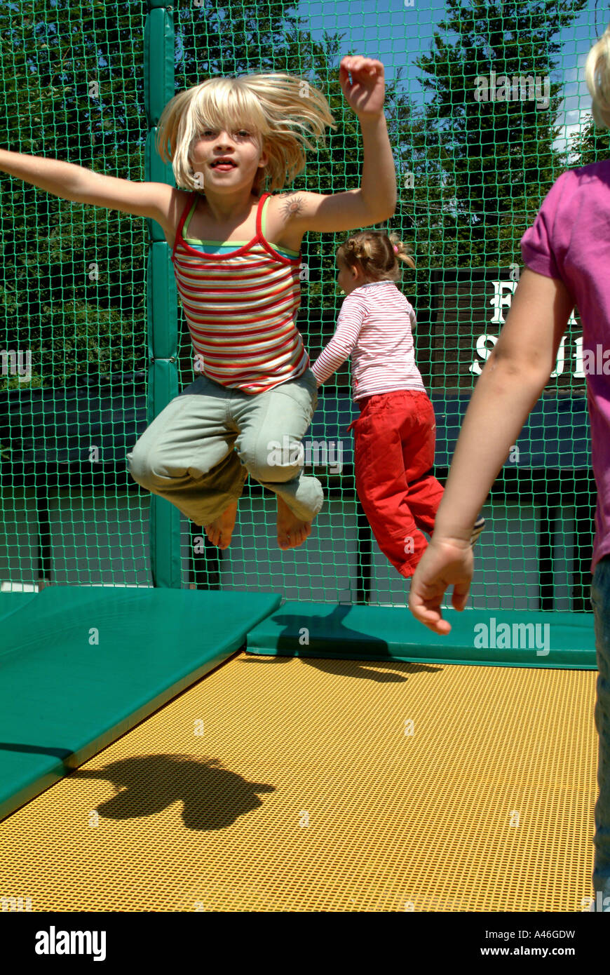 Little child jumping on a trampoline Stock Photo Alamy