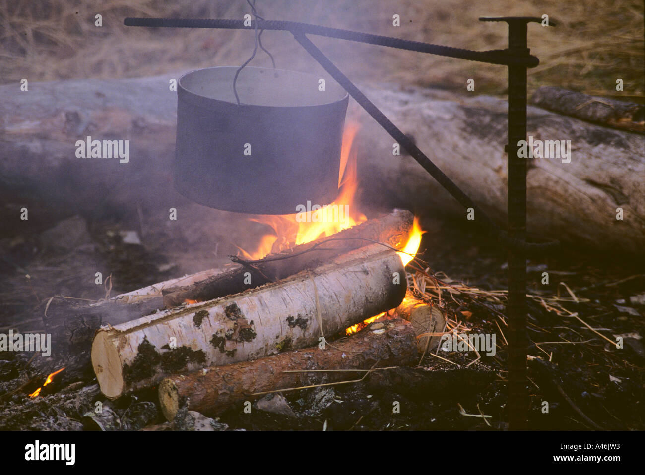 Pot over camp fire Kochtopf ueber Lagerfeuer Stock Photo
